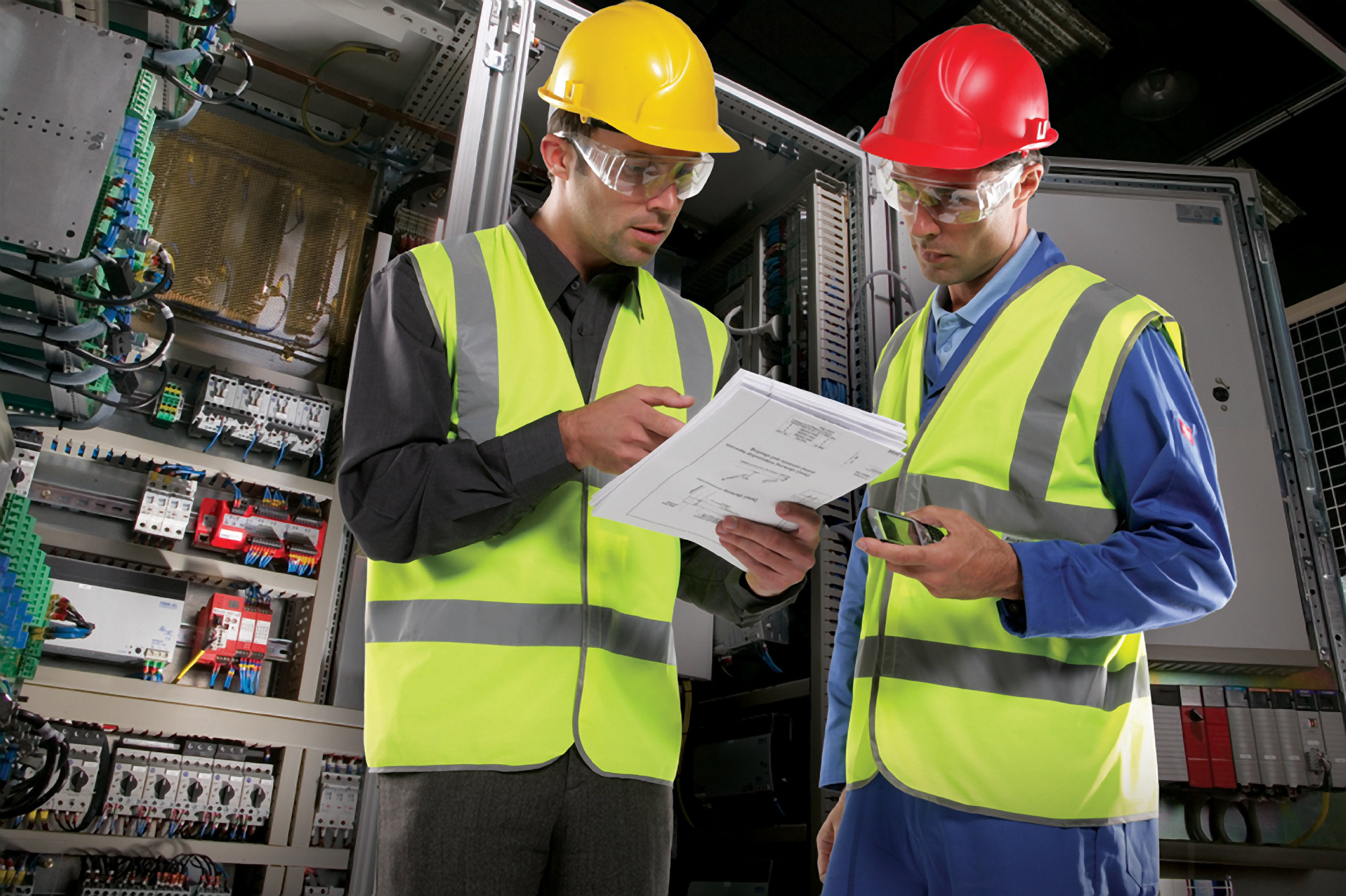 two engineer looking at documents together