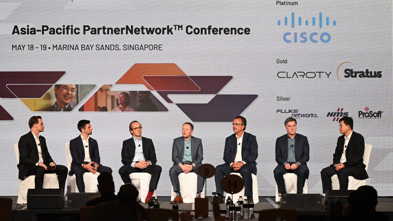 Speakers for AP Partner Network Conference are sitting on stage for pannel discussion.