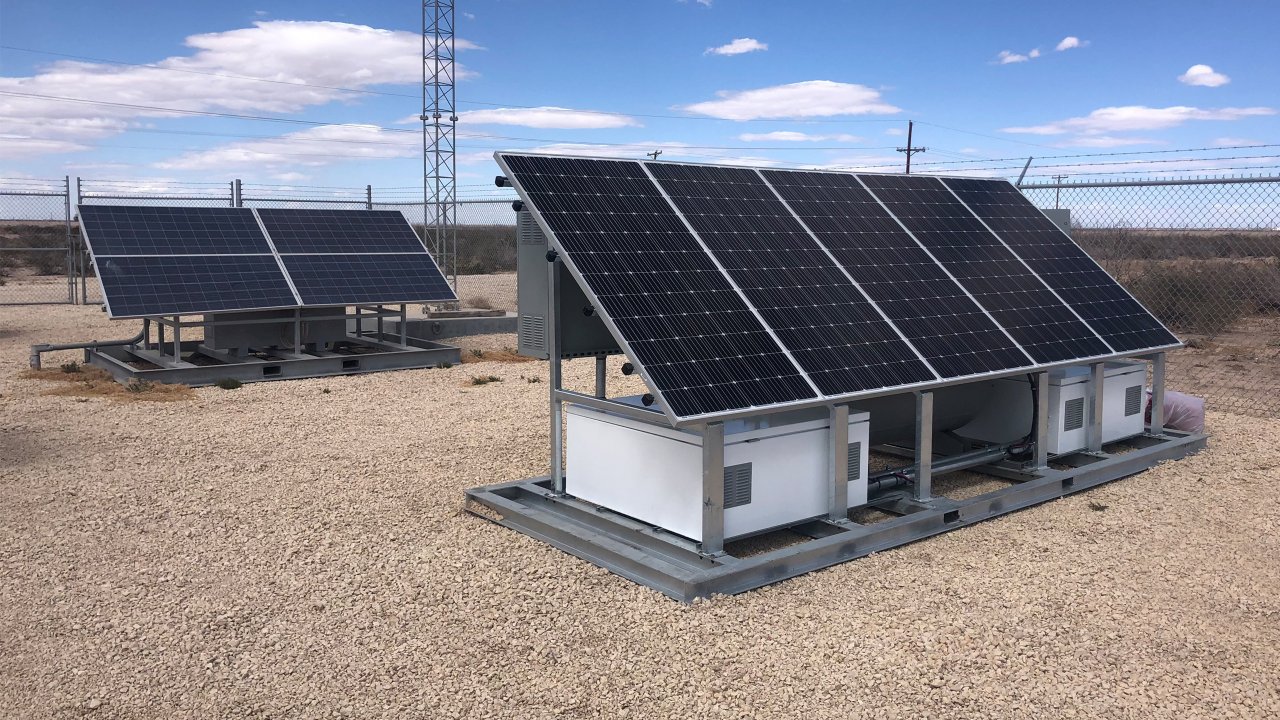 Solar-powered oil and gas pipeline valve actuation station provided by Endpoint Industrial Controls.  Valve actuation station for an oil and gas pipeline located in a desert environment. The system features an array of black solar panels