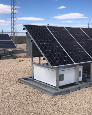 Solar-powered oil and gas pipeline valve actuation station provided by Endpoint Industrial Controls.  Valve actuation station for an oil and gas pipeline located in a desert environment. The system features an array of black solar panels