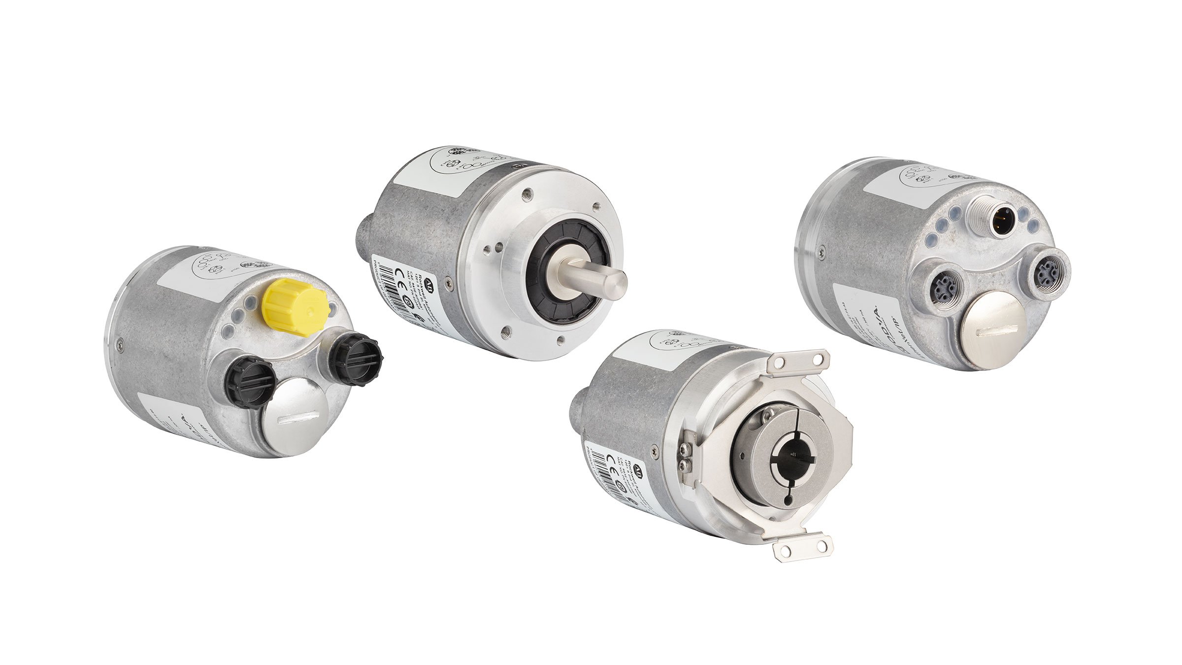 Four 843E Absolute Encoders with EtherNet/IP all made of stainless steel and cylindrical in shape; from left to right: Rear view with four connectors; one with yellow plastic cap (12:00), one with steel conduit cover (6:00), and two with black plastic caps (3:00 and 9:00).  Front view option with solid steel shaft protruding from the center of the face. Front view option with hollow shaft in the center and mounting brackets at 12:00 and 6:00. Rear view with four connectors; one 12 mm micro male connector (12:00), one with steel conduit cover (6:00), and two 12 mm micro female connectors (3:00 and 9:00).