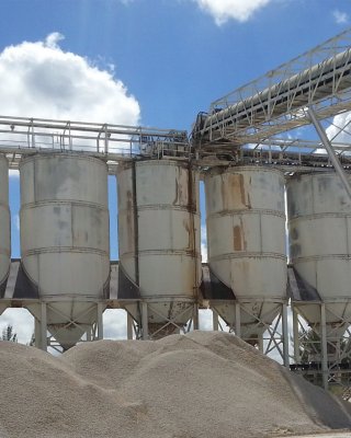 Cemex Florida aggregate storage silos fed by conveyors