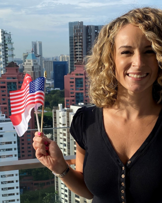 Bridget Martin smiles at the camera from her home in Singapore, where her supply chain career has taken her.