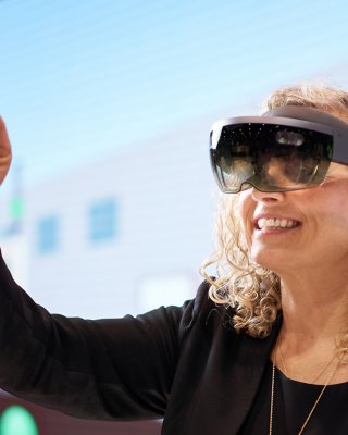 Woman wears a Virtual Reality headset on