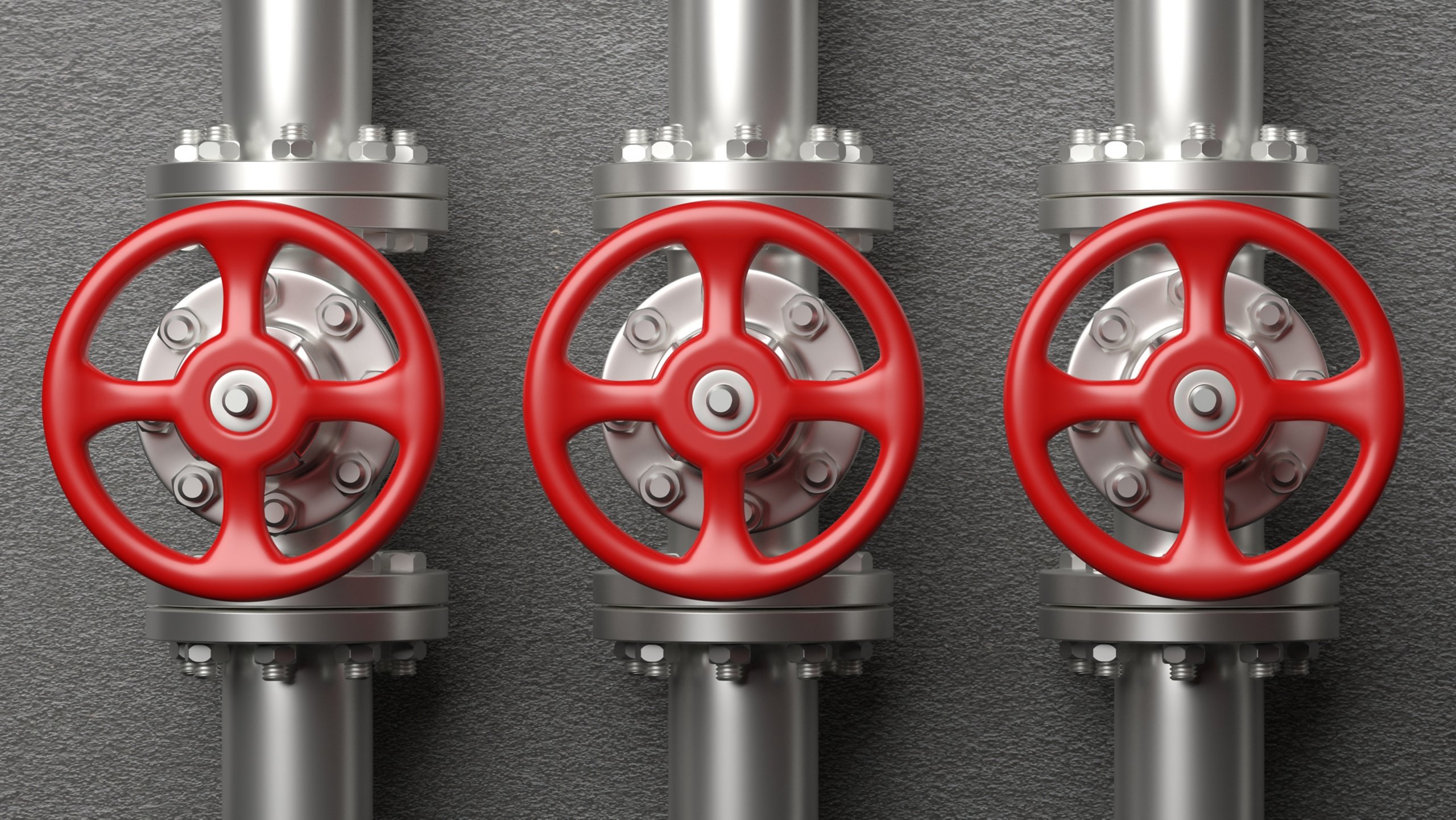 Silver oil & gas pipelines and valves with red wheels to secure critical infrastructure OT system.