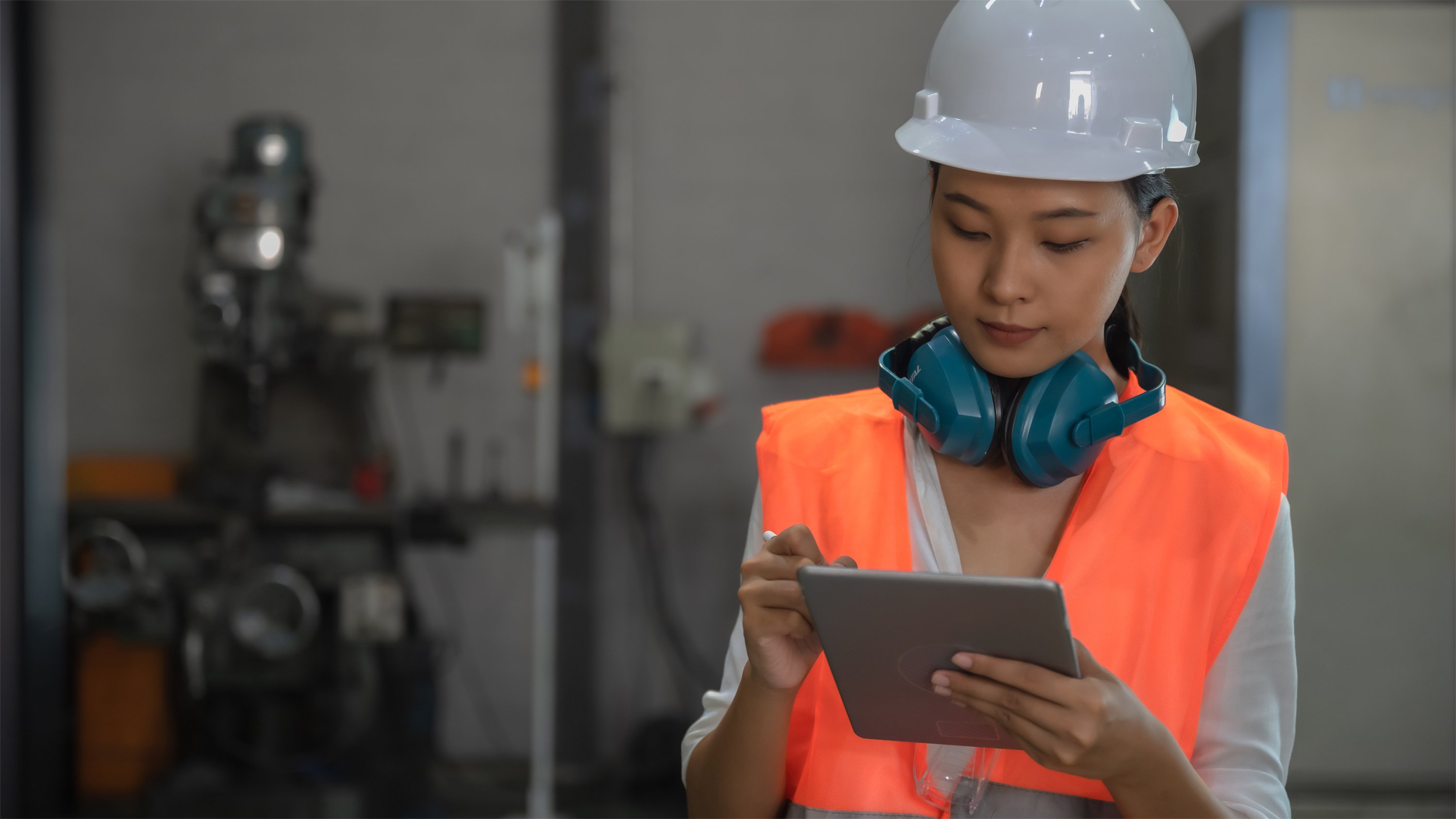 Company operator viewing her tablet