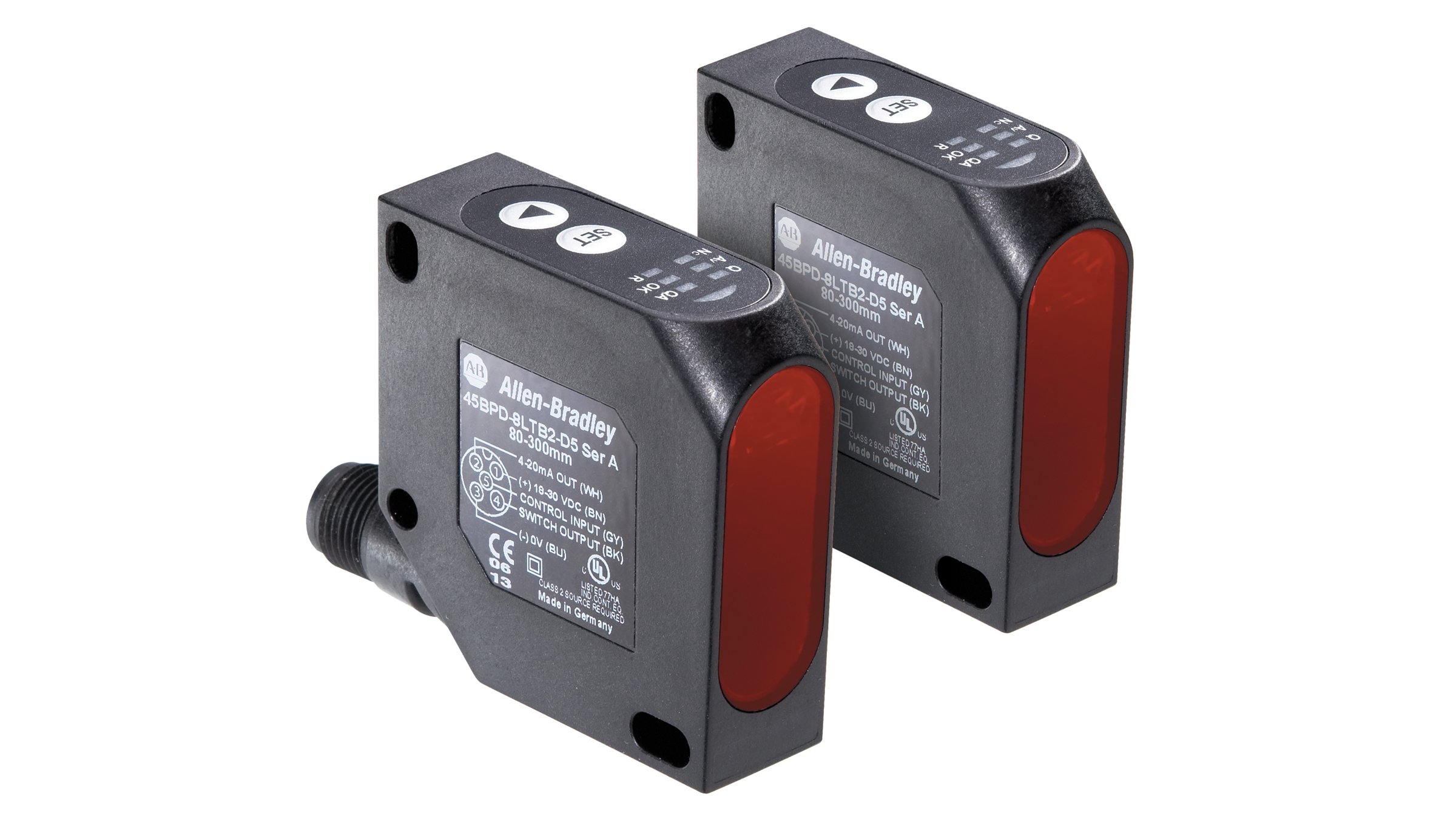 Two black Allen-Bradley rectangular sensors with red lenses.