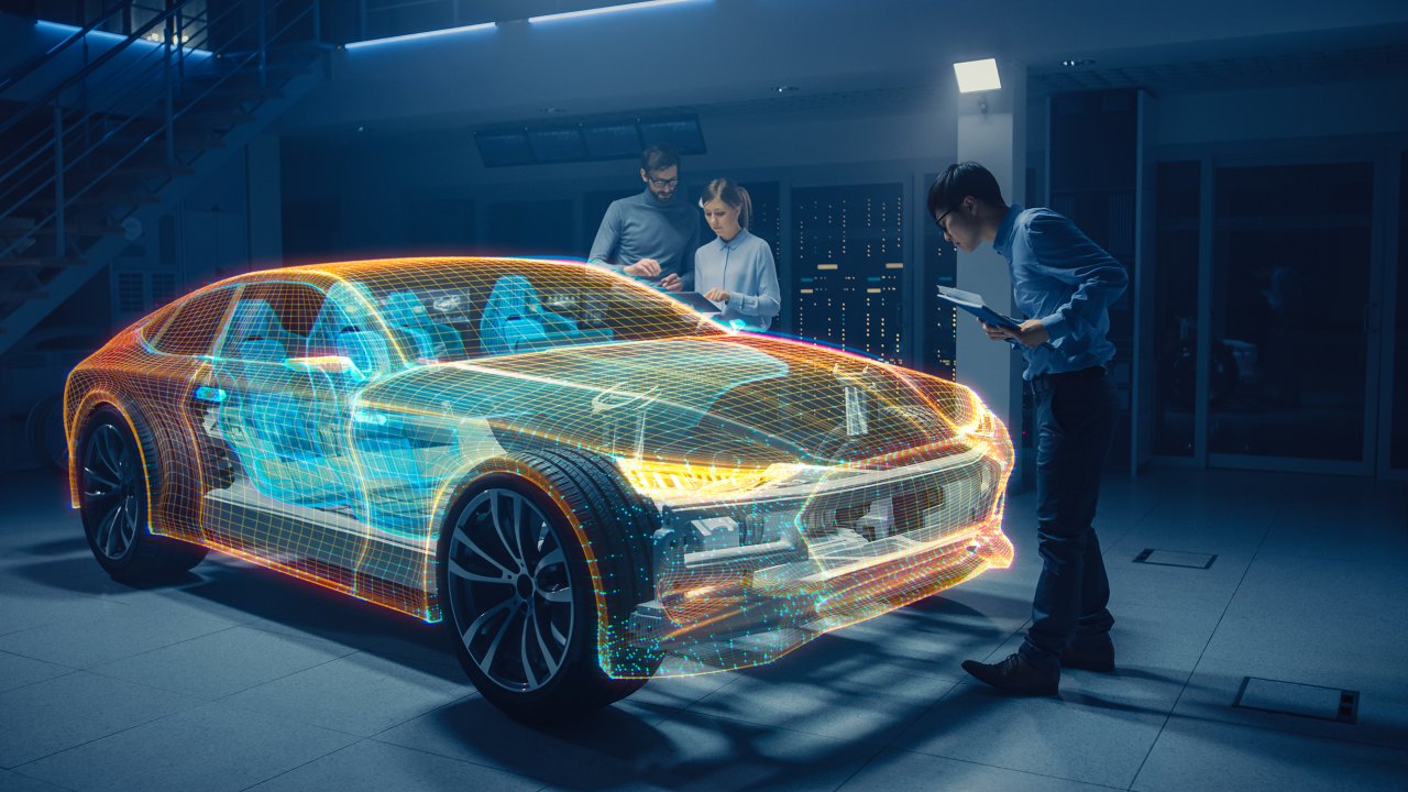 Eine Gruppe von Automobilkonstrukteuren arbeitet in der virtuellen Realität an einem 3D-Modell des Fahrgestells eines Elektroautos