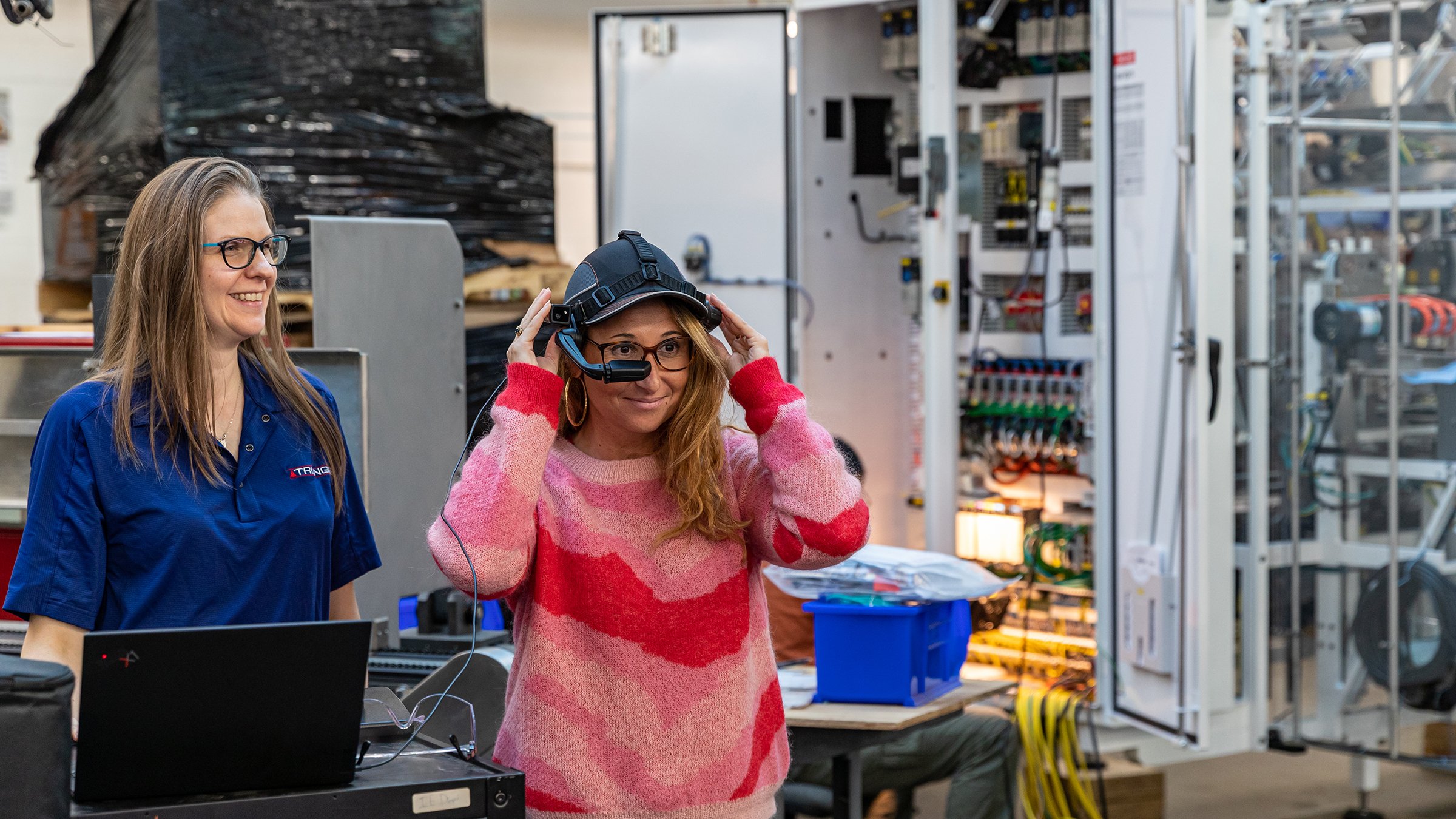 Rockwell Automation media visit to Triangle Packaging in Chicago, IL. Woman wearing VR headset.