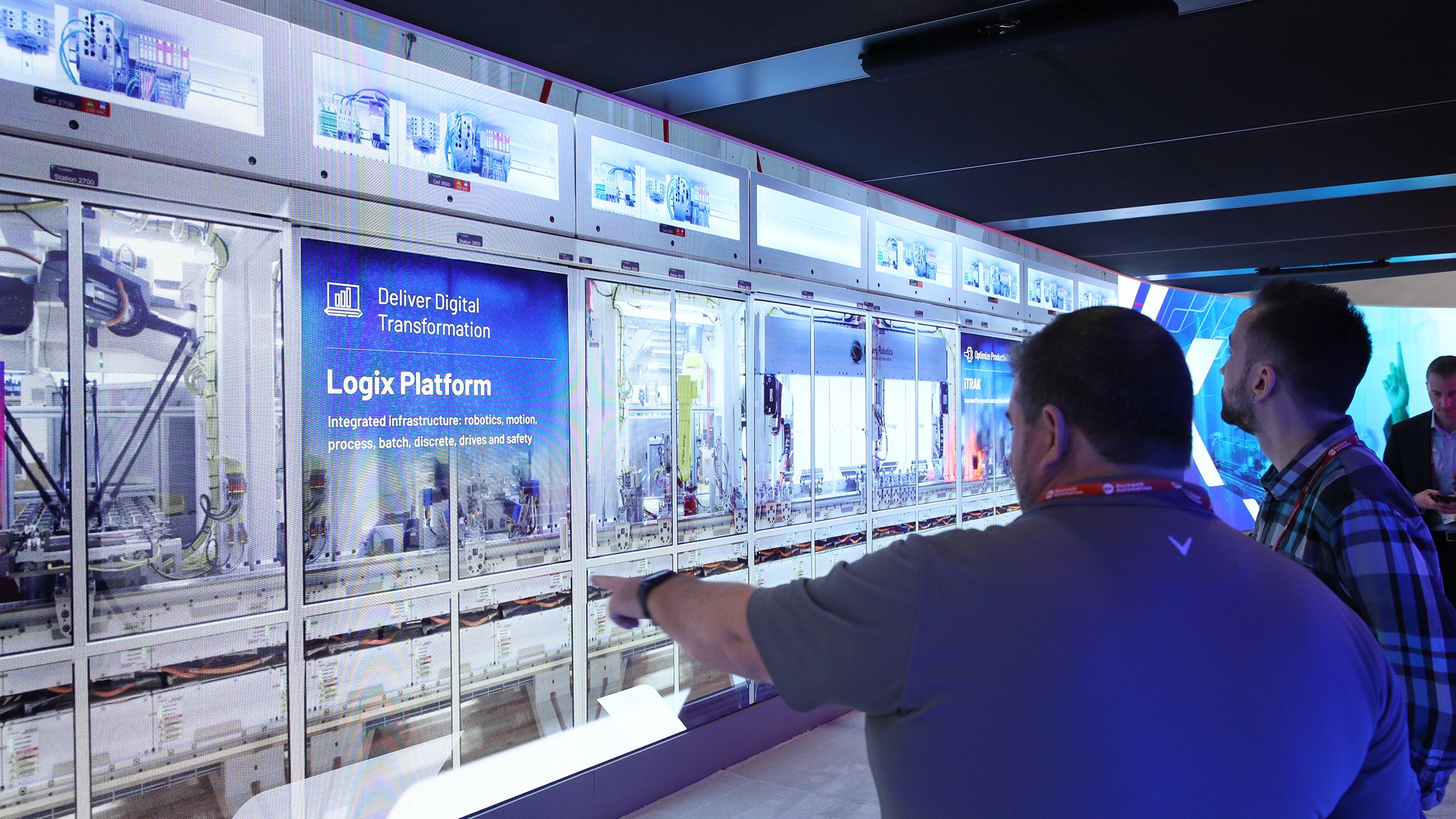 Two men looking at the Innovations display at Rockwell Automation Automation Fair 2022