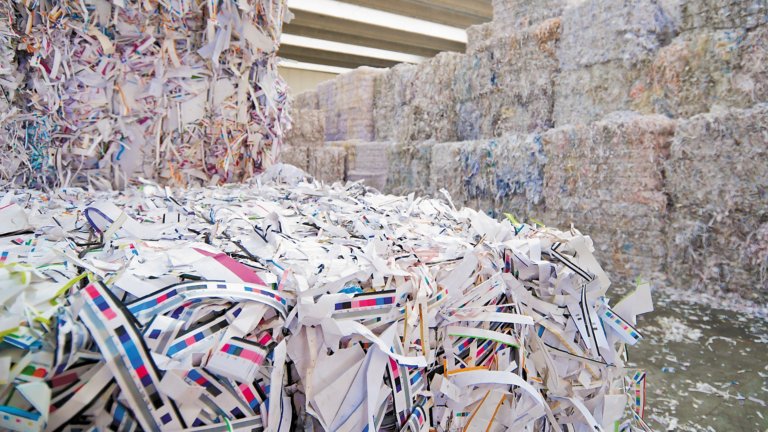 Bales of recycled shredded paper scraps