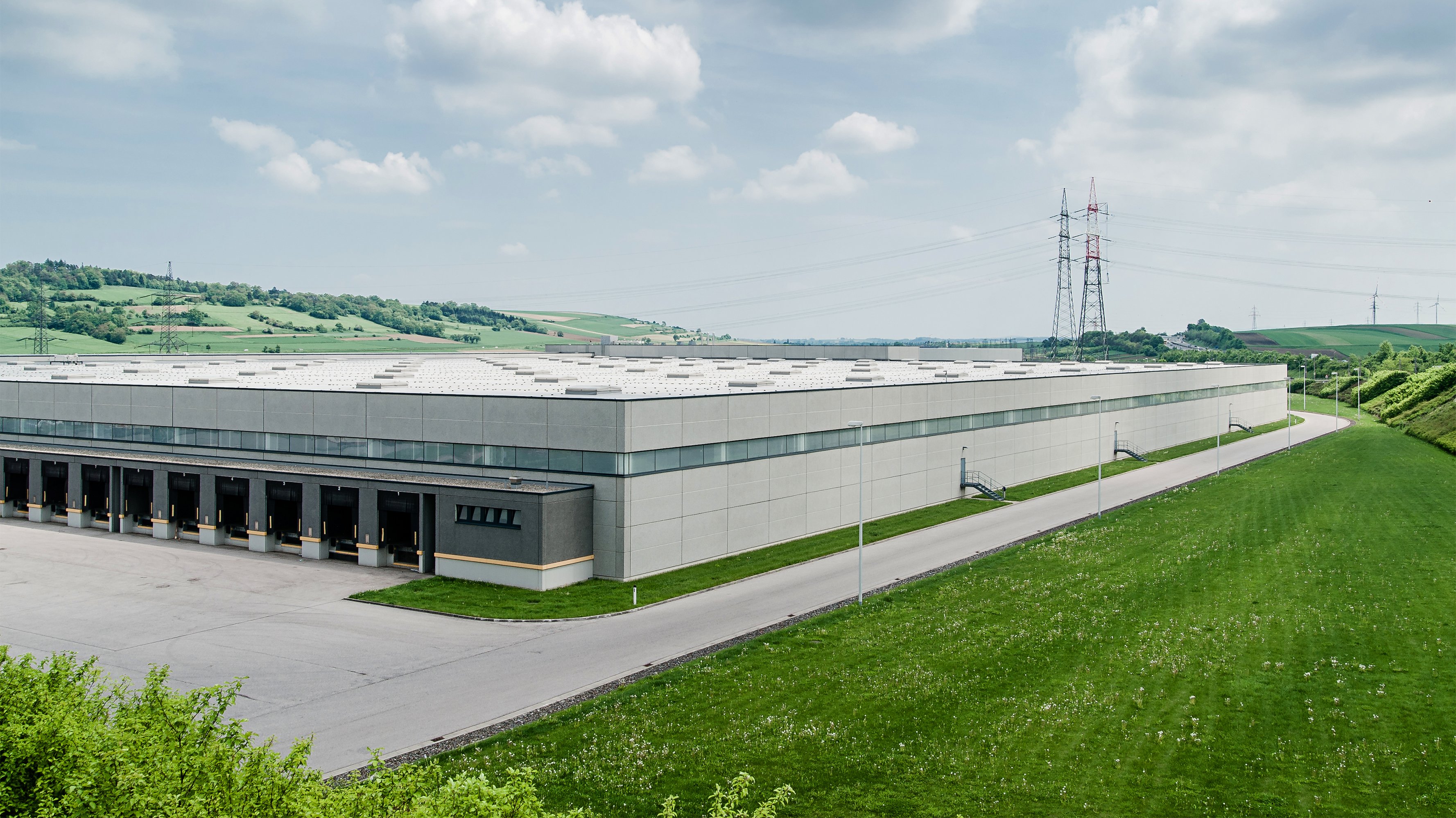 Distribution centre building surrounded by green field