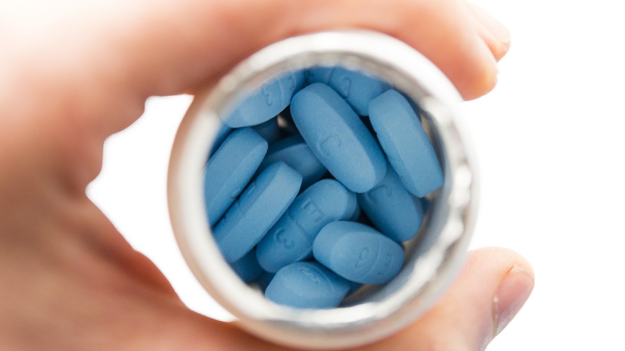 Blue pills made by Pfizer in plastic bottle