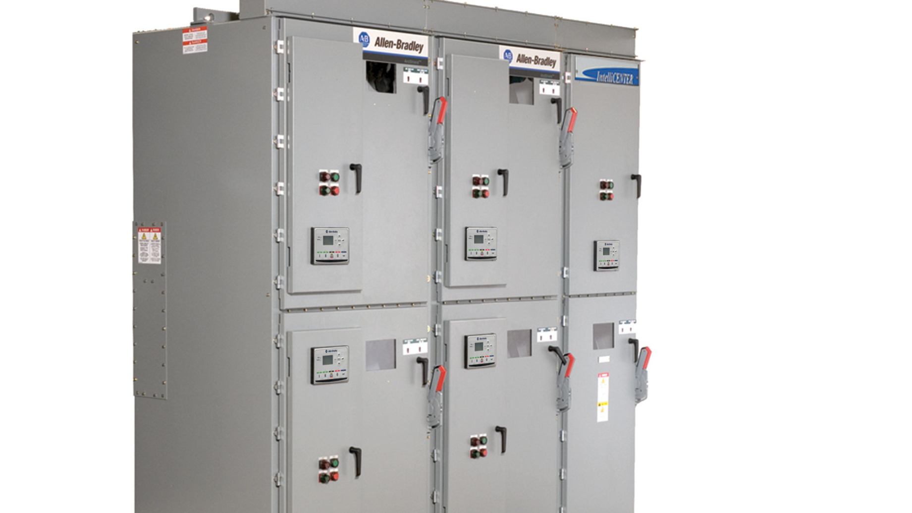 Large gray rectangular metal industrial structure, with three sections wide and two sections tall, for electrical motor components