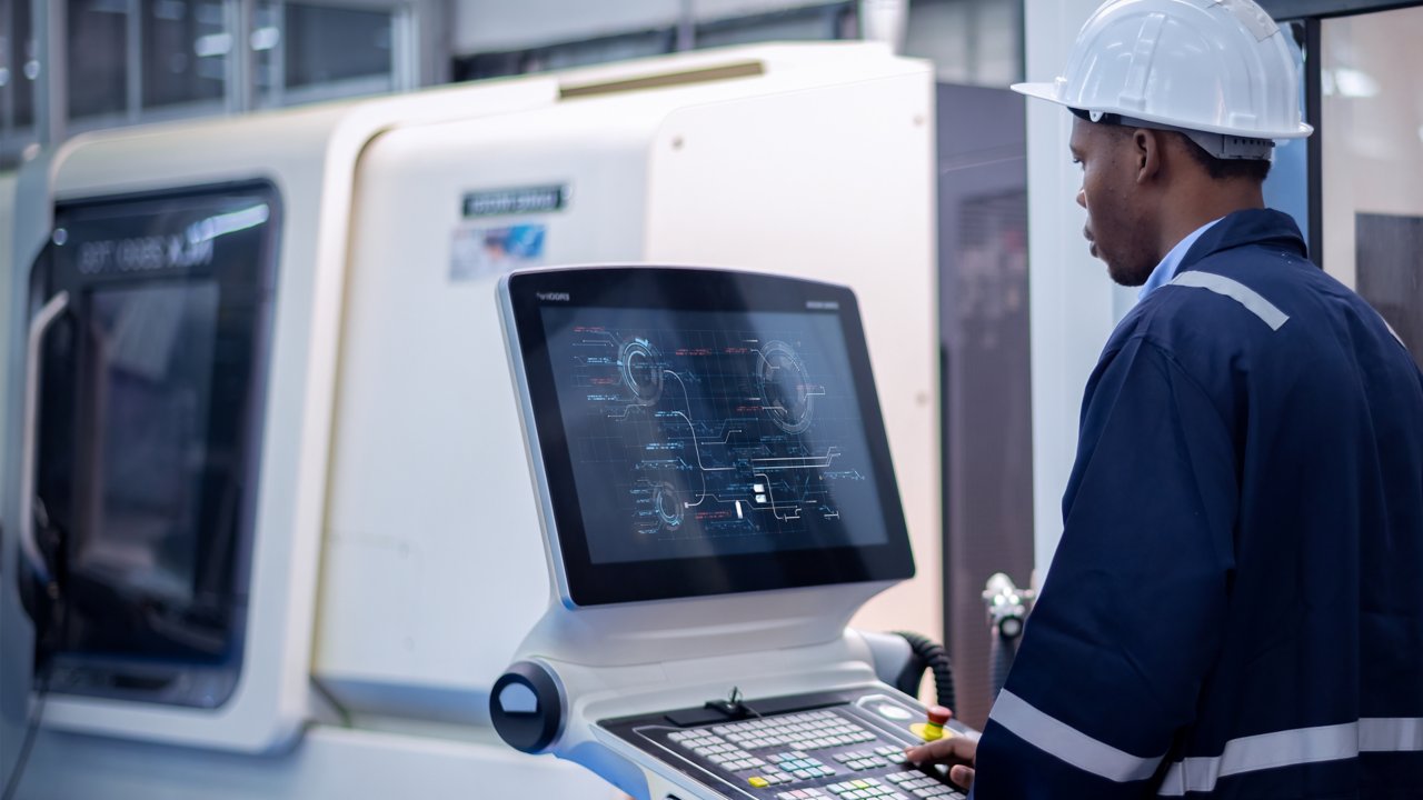 Engineer using digital factory production machine