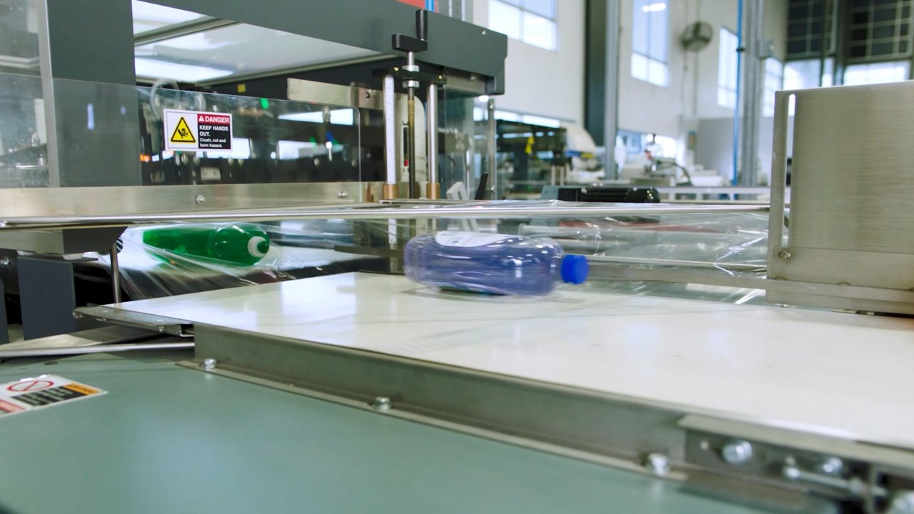 dish soap traveling on a packaging line in a manufacturing facility