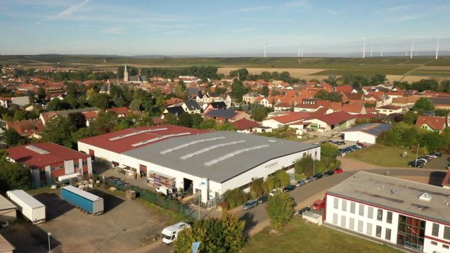 Econopak Production Hall surrounded by buildings and trees, view from top