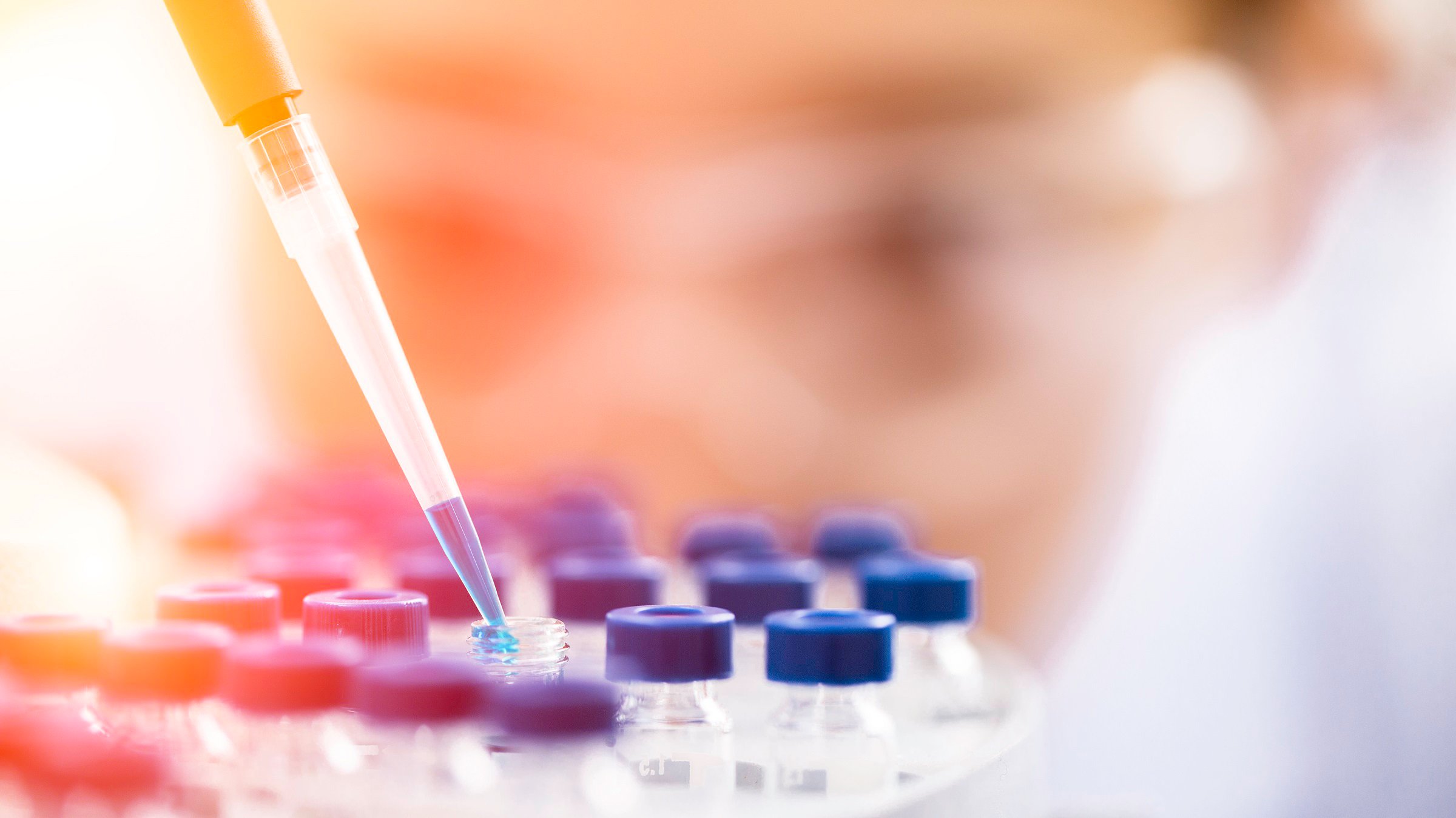 Female chemist at work in laboratory.