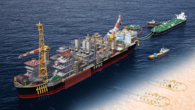 Large FPSO vessel with oil tanker attached and subsea production shown underneath to the right, floating on dark blue sea.. A working FPSO vessel on the deep blue ocean with oil tanker attached and subsea production activity below.
