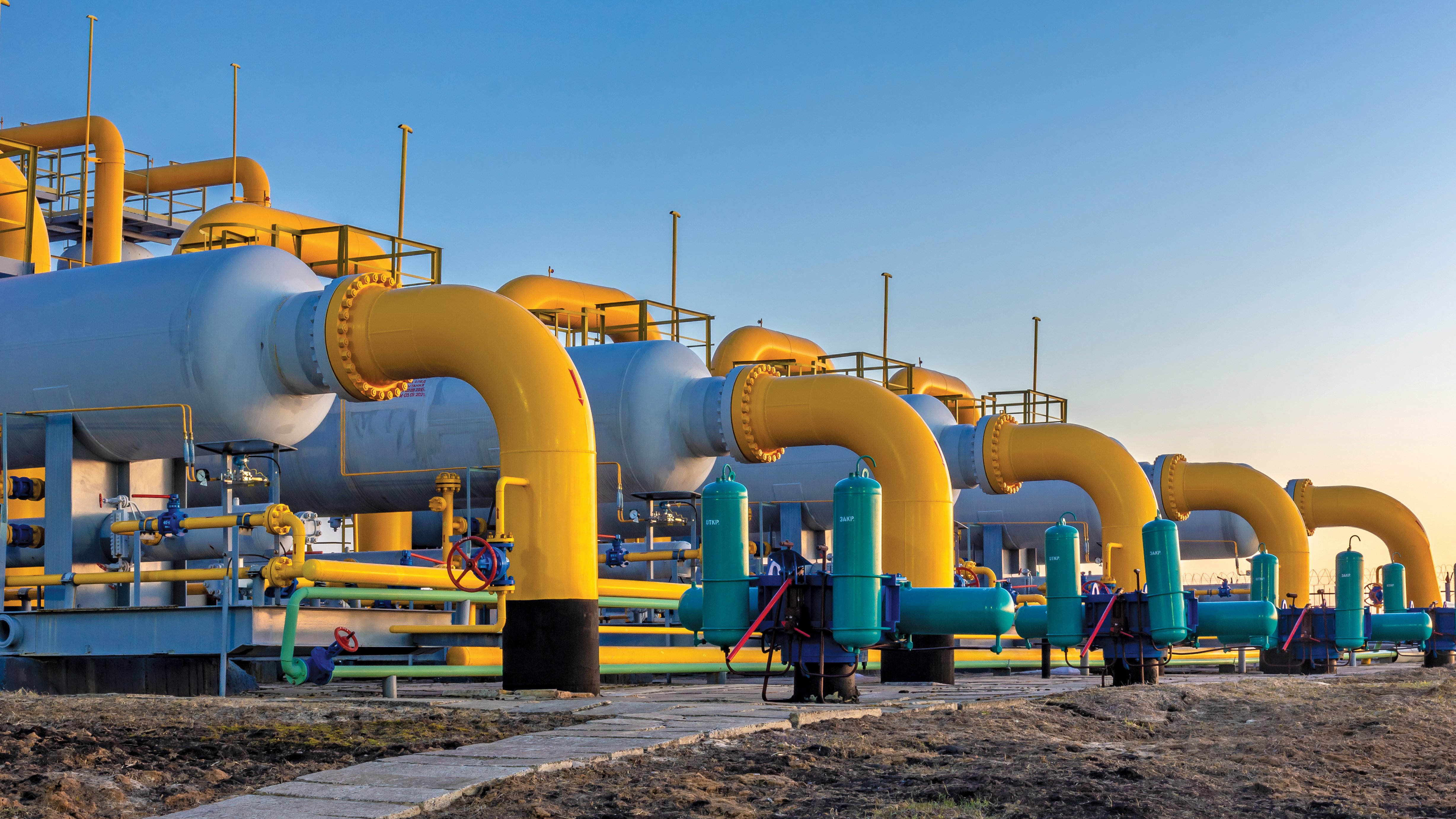 Gas filters-separators with valves on a blue sky background.