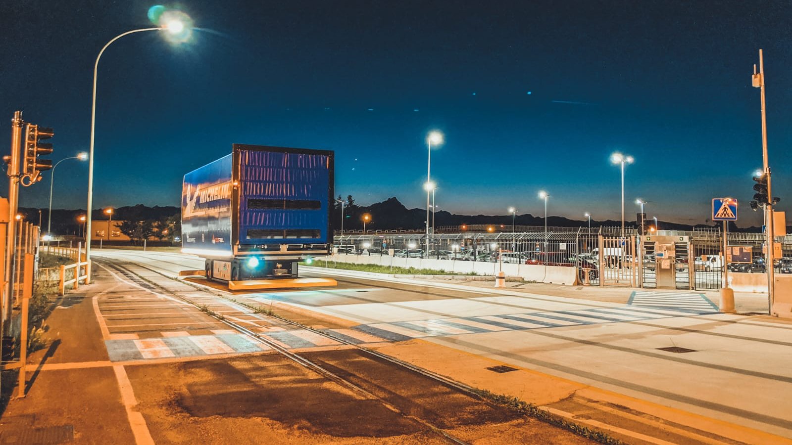 Michelin container on track in night lights