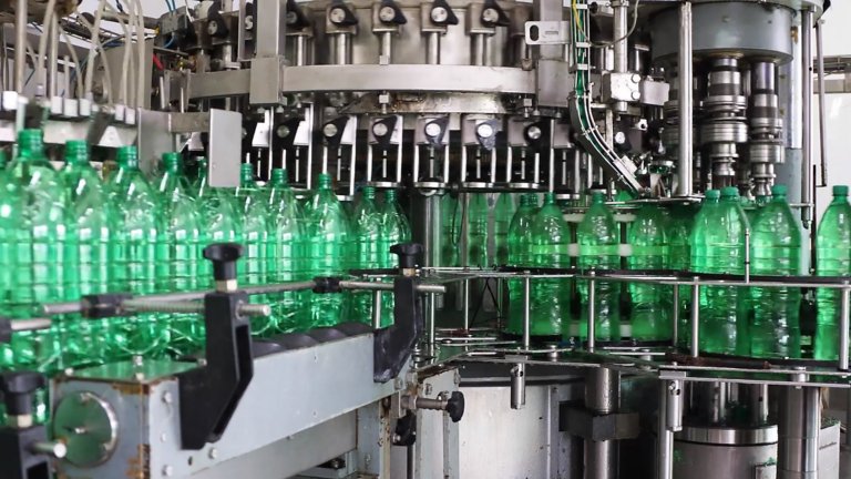 Bottles running through a manufacturing line