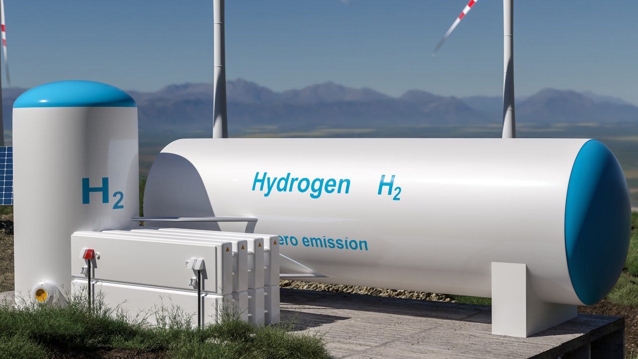 Hydrogen renewable energy production facility with solar panels and wind turbines