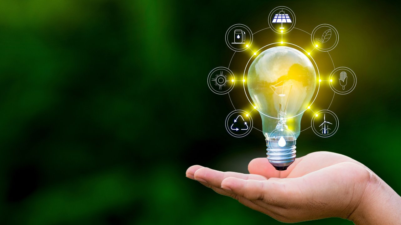 An image of a lightbulb with icons surrounding it representing sustainability in the process industry.