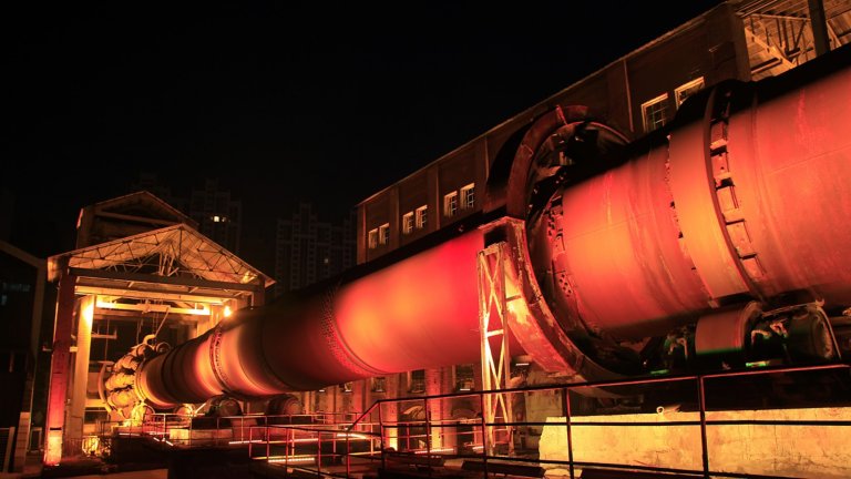 Rotary kiln in cement plant at night
