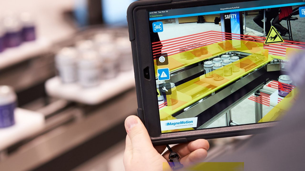 User holding an augmented reality tablet for industrial training