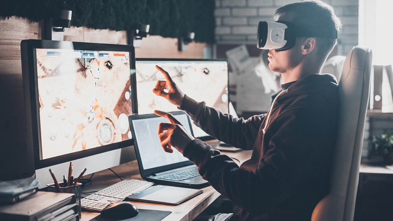 Man wearing VR headset managing industrial automation