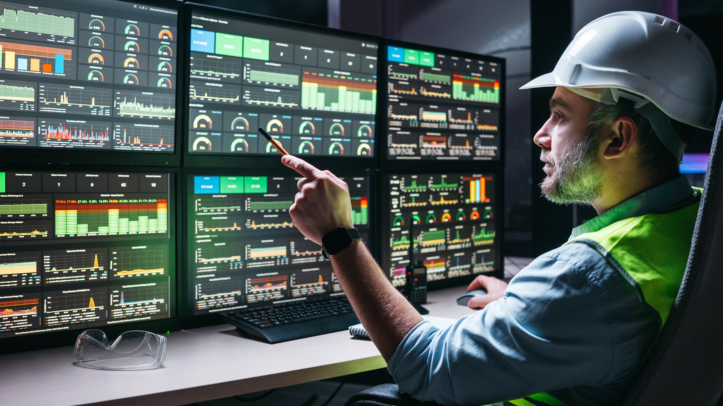 Manufacturing controls engineer using SCADA and digital technology to monitor and assembly line.