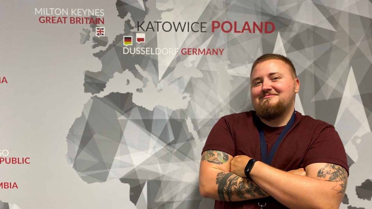 Marcin Czyszcson, a transgender man, poses in the Katowice, Poland office where he works. 