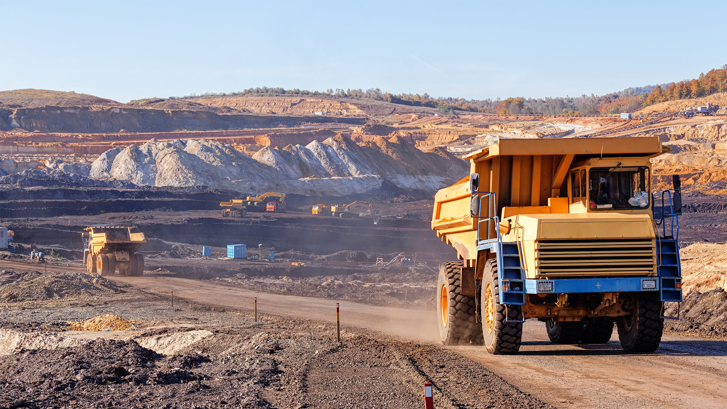 Big trucks in mining pit