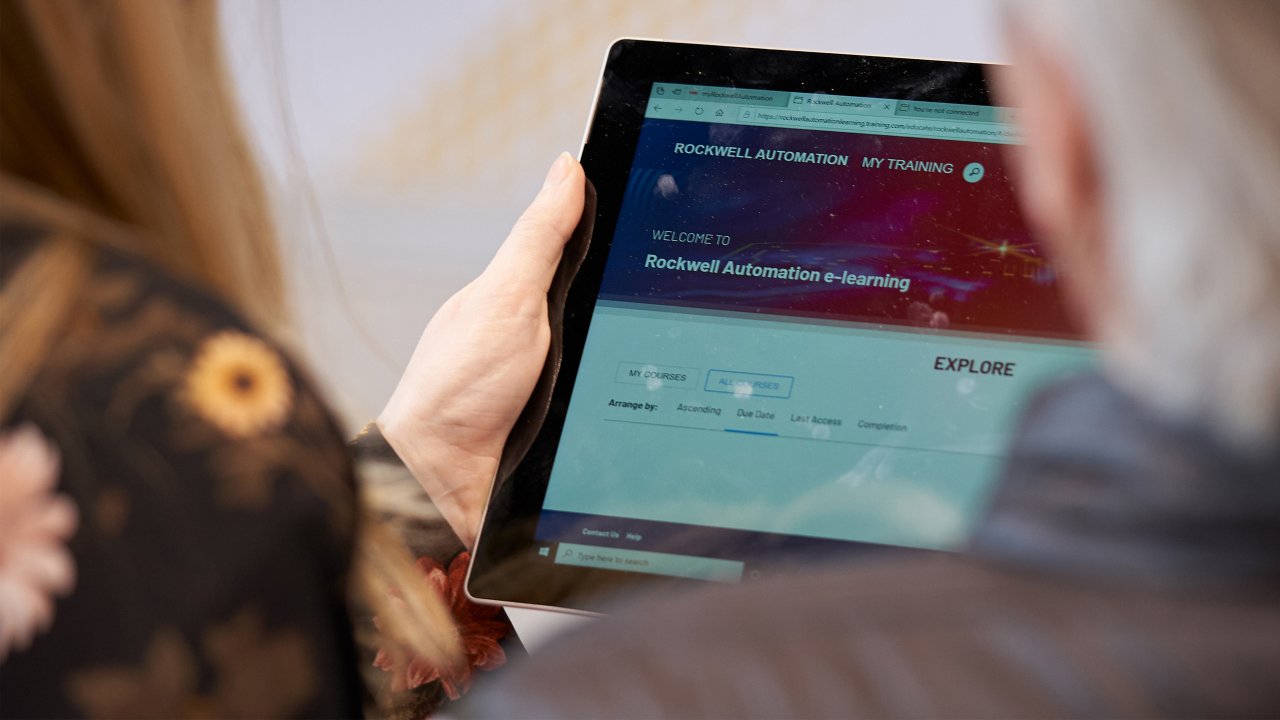 man looking at e-learning courses in the My Training portal on a tablet