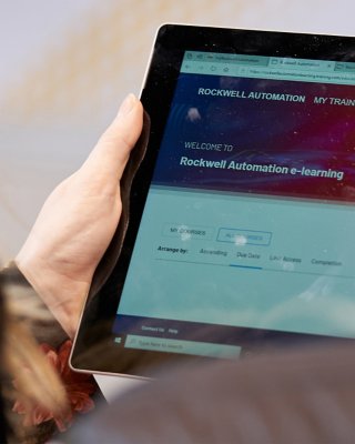 man looking at e-learning courses in the My Training portal on a tablet