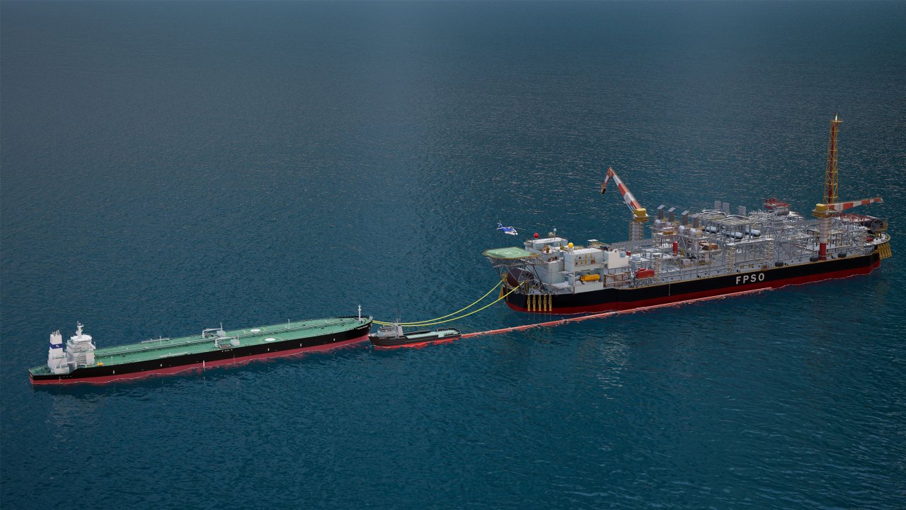 FPSO vessel overhead side view in the middle of the ocean with tugboat and towing vessel