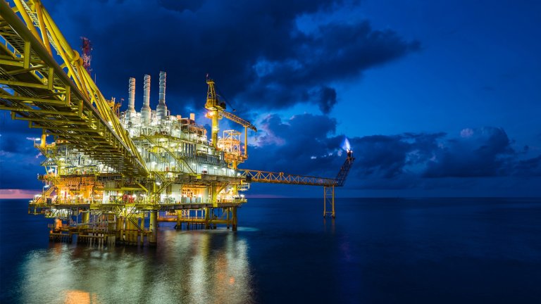 Offshore oil rigs depend on industrial motor controls, such as PowerFlex VFDs, to increase productivity and uptime. Panorama of oil and gas central processing platform in sun set where produced, treat the hydrocarbon then sent to refinery , petrochemical , power generation plant and tanker barge for export.