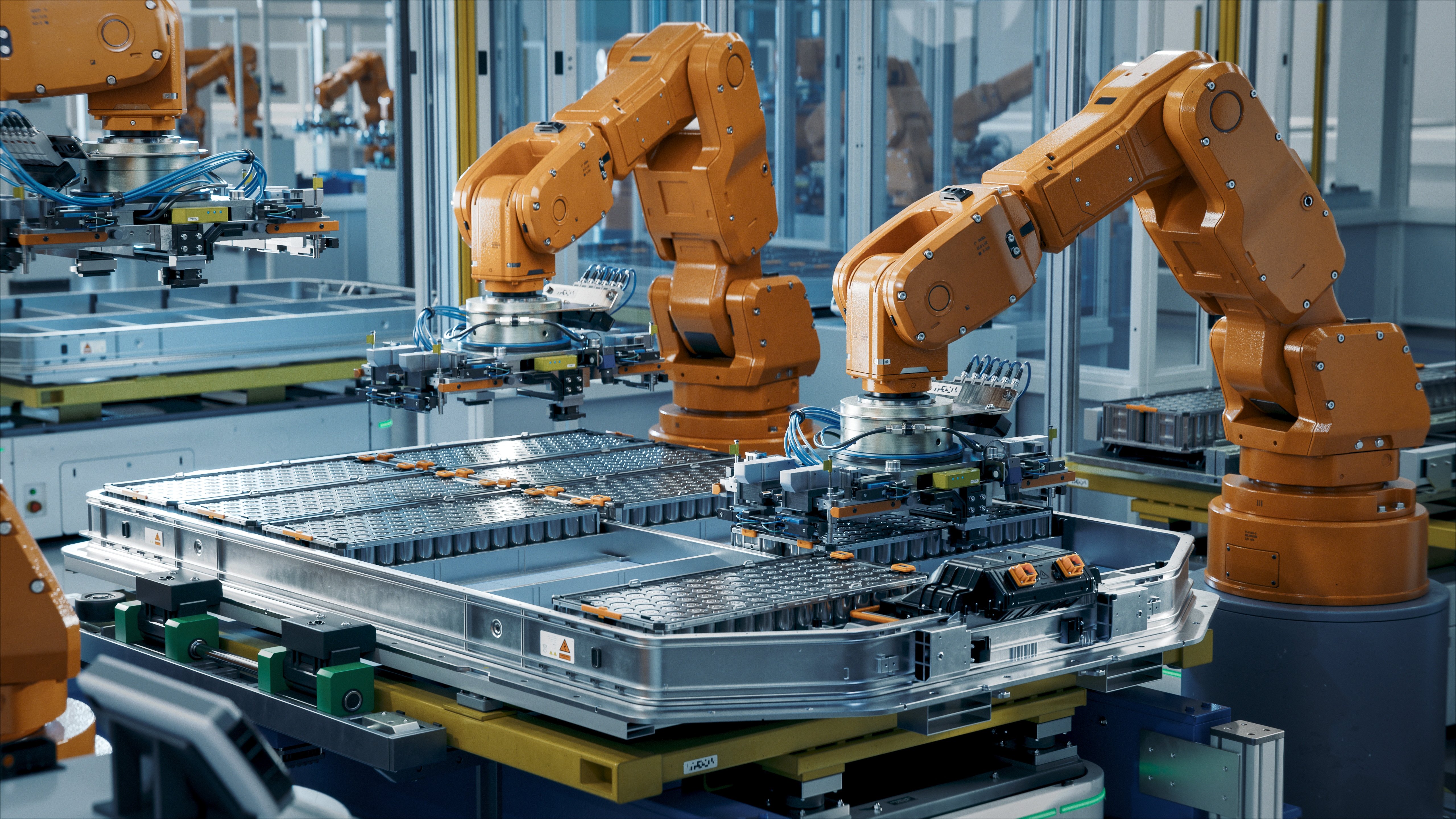 Orange Industrial Robot Arms Assemble EV Battery Pack on Automated Production Line. Row of Advanced Robotic Arms inside Automotive Plant Assemble Batteries. Modern Electric Car Smart Factory.