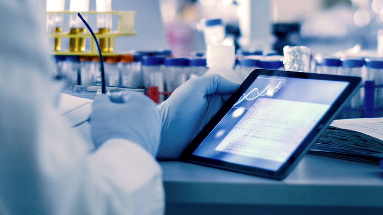 Pharma Scientist Using Tablet in Smart Tech Laboratory