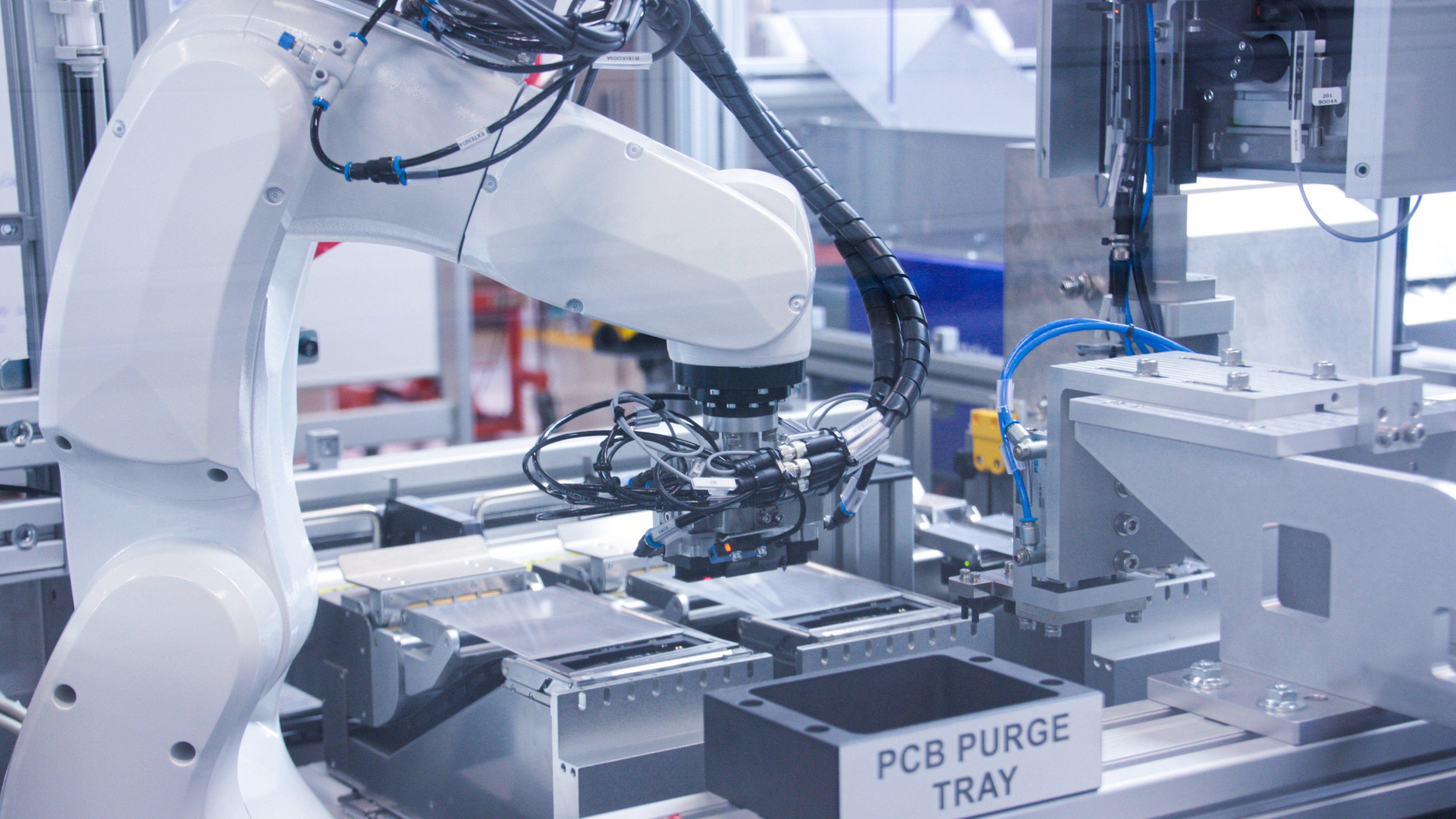 Robotic arms in manufacturing  diagnostic tests in production line.