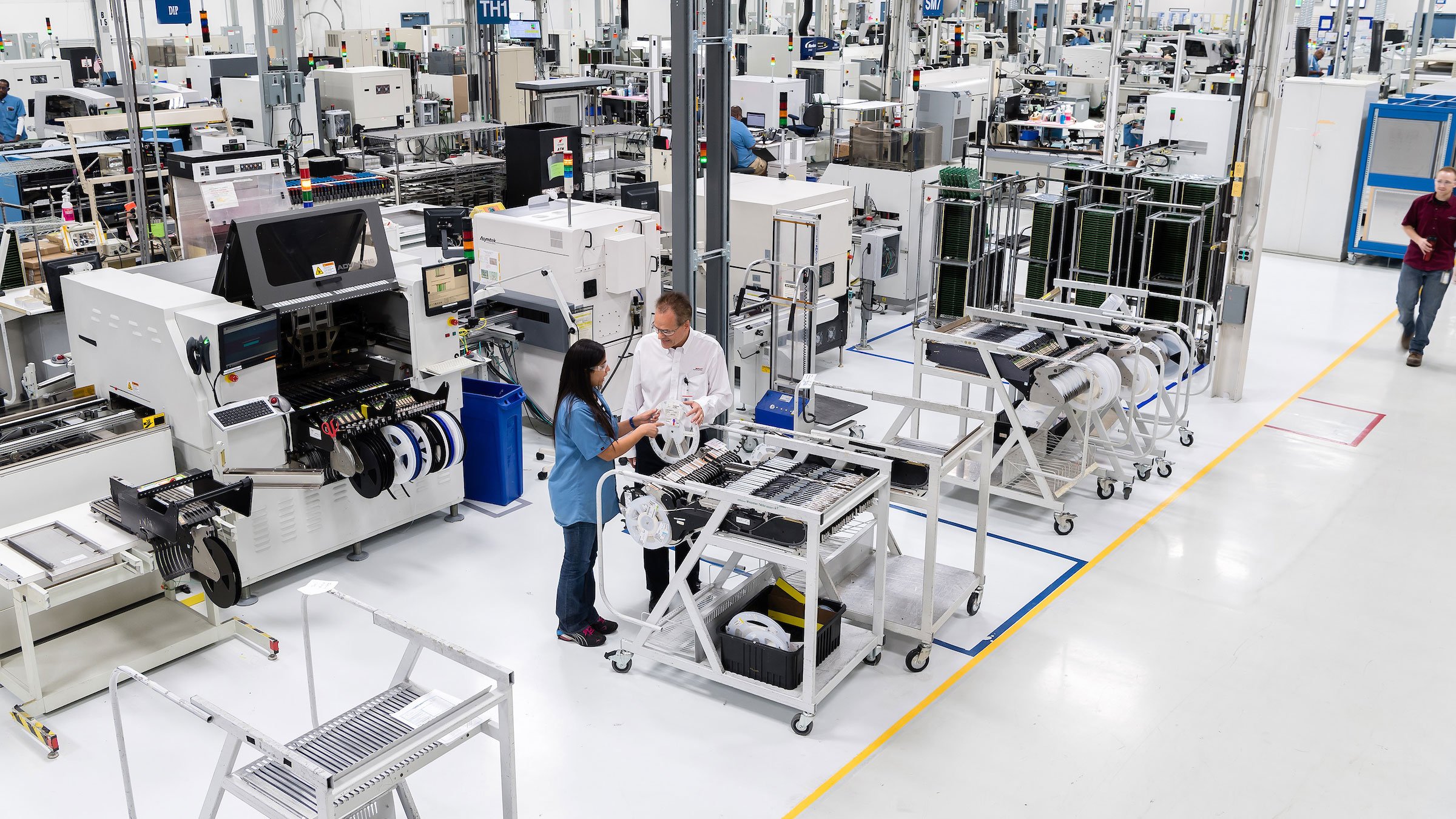 Two people on the plant floor