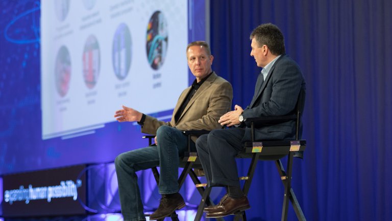 Rockwell Automation leadership discussing new strategies and innovations on stage during a keynote presentation.