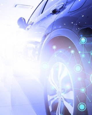Imagen futurista de un automóvil con enfoque en los neumáticos con un gráfico superpuesto que muestra círculos de luz conectados con líneas.