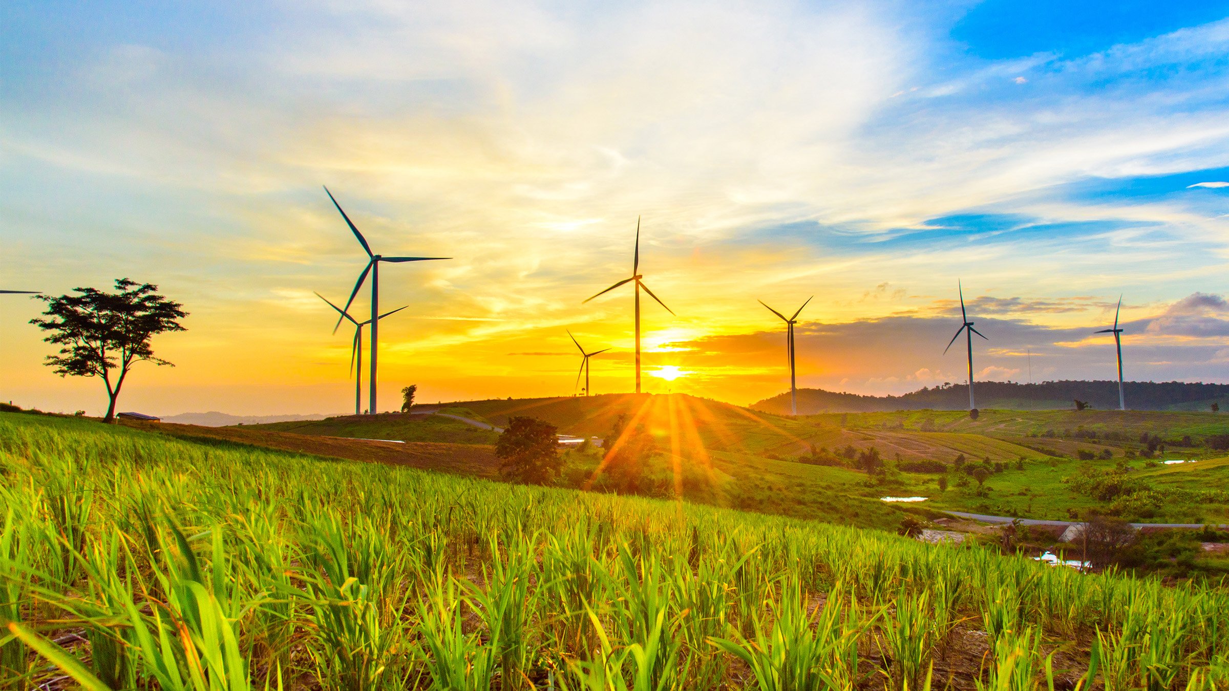 Wind generators turbines at sunset. Beautiful mountain landscape with wind generators turbines at Khao Kho mountain, Thailand. Renewable energy concept.