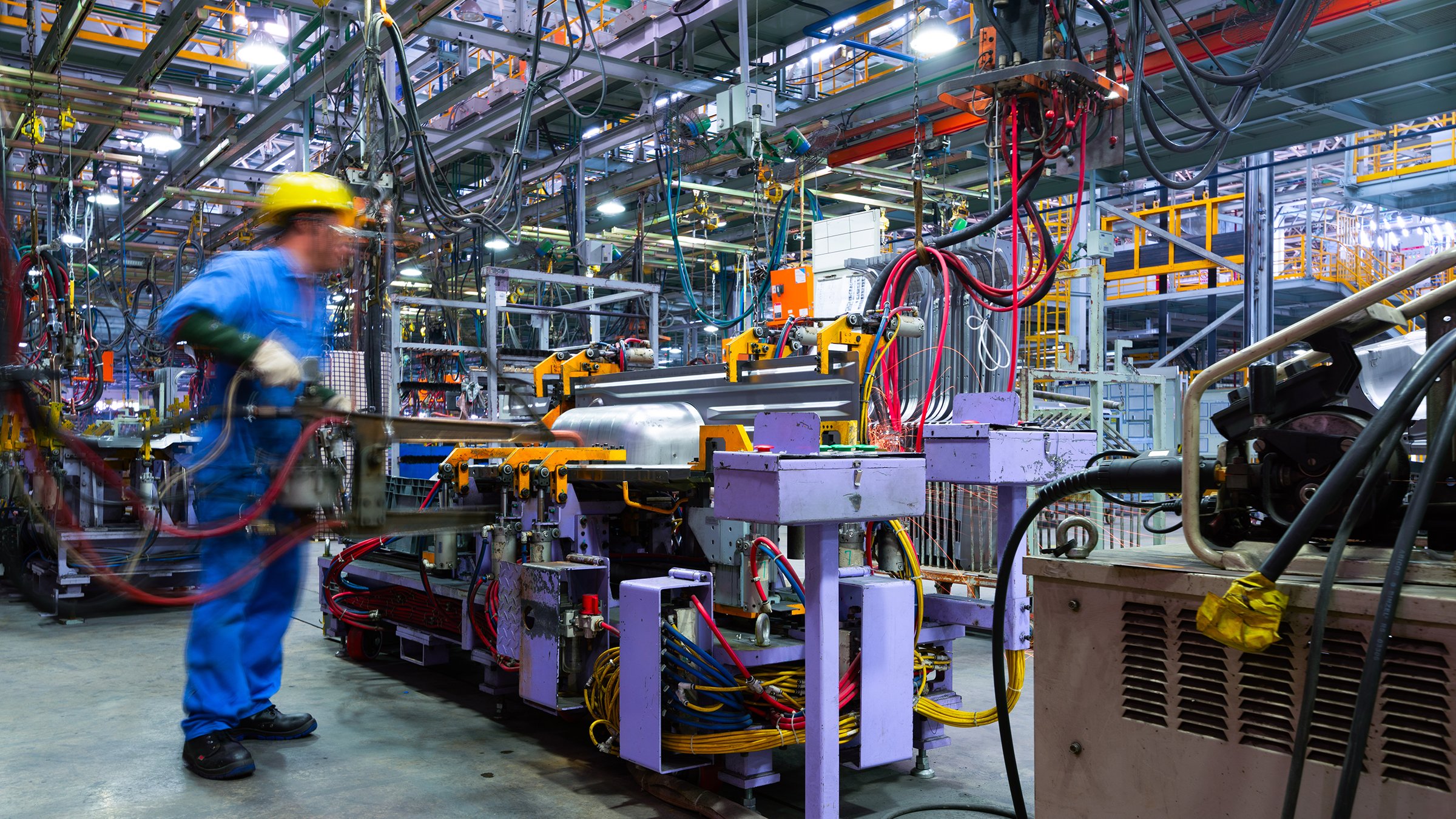 Modern automatic automobile manufacturing workshop. A busy car production line. Industrial scenery background.