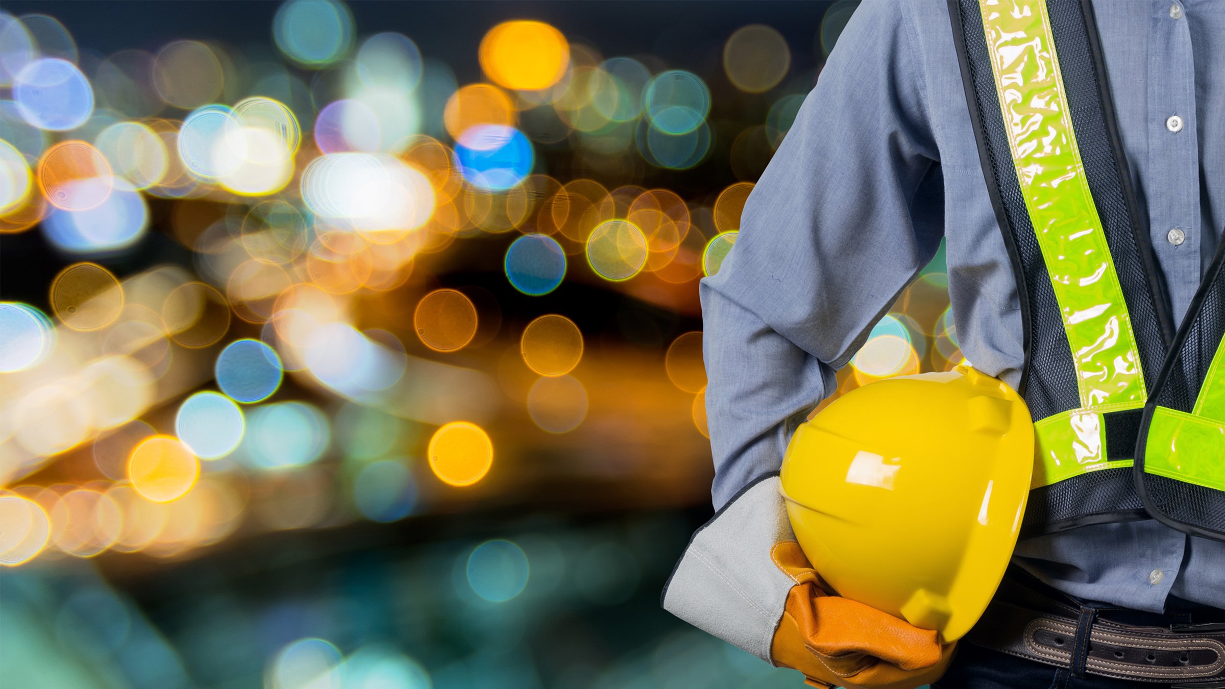 Worker in yellow vest and yellow hard hat