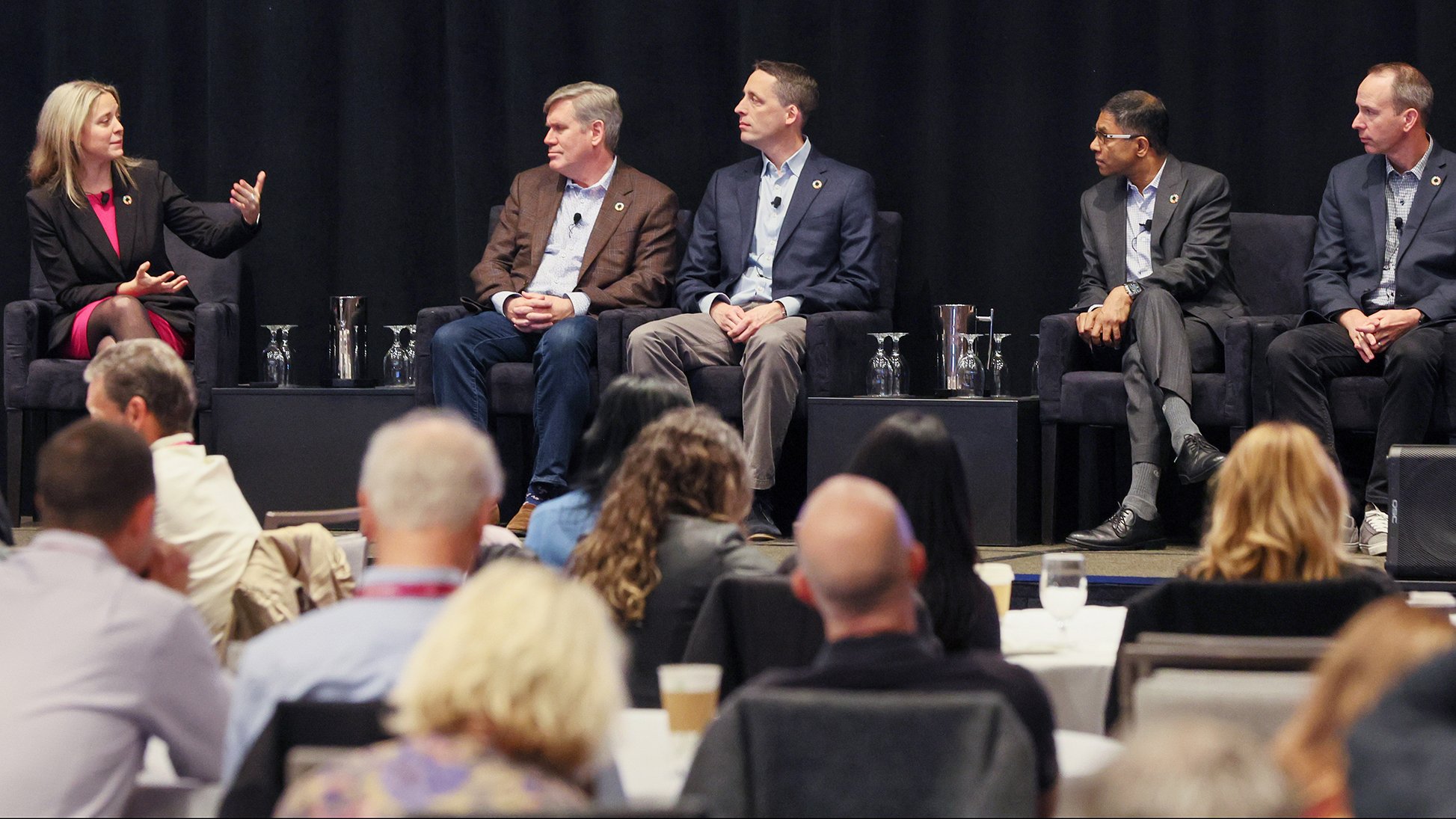 Automation Fair 2023 speakers on stage with audience at session.