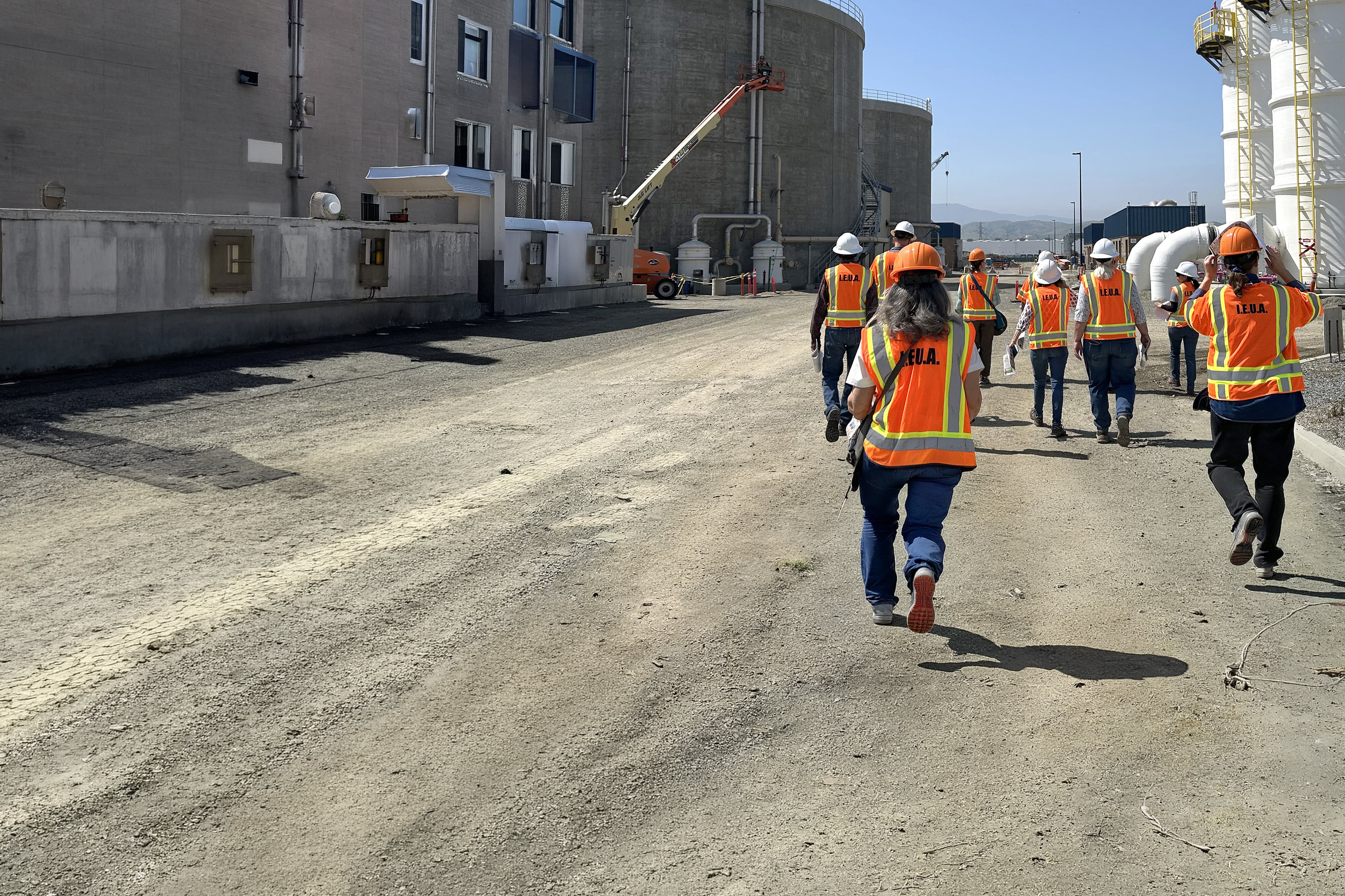 Workers in IEUA vests and hardhats at treatment facilitie