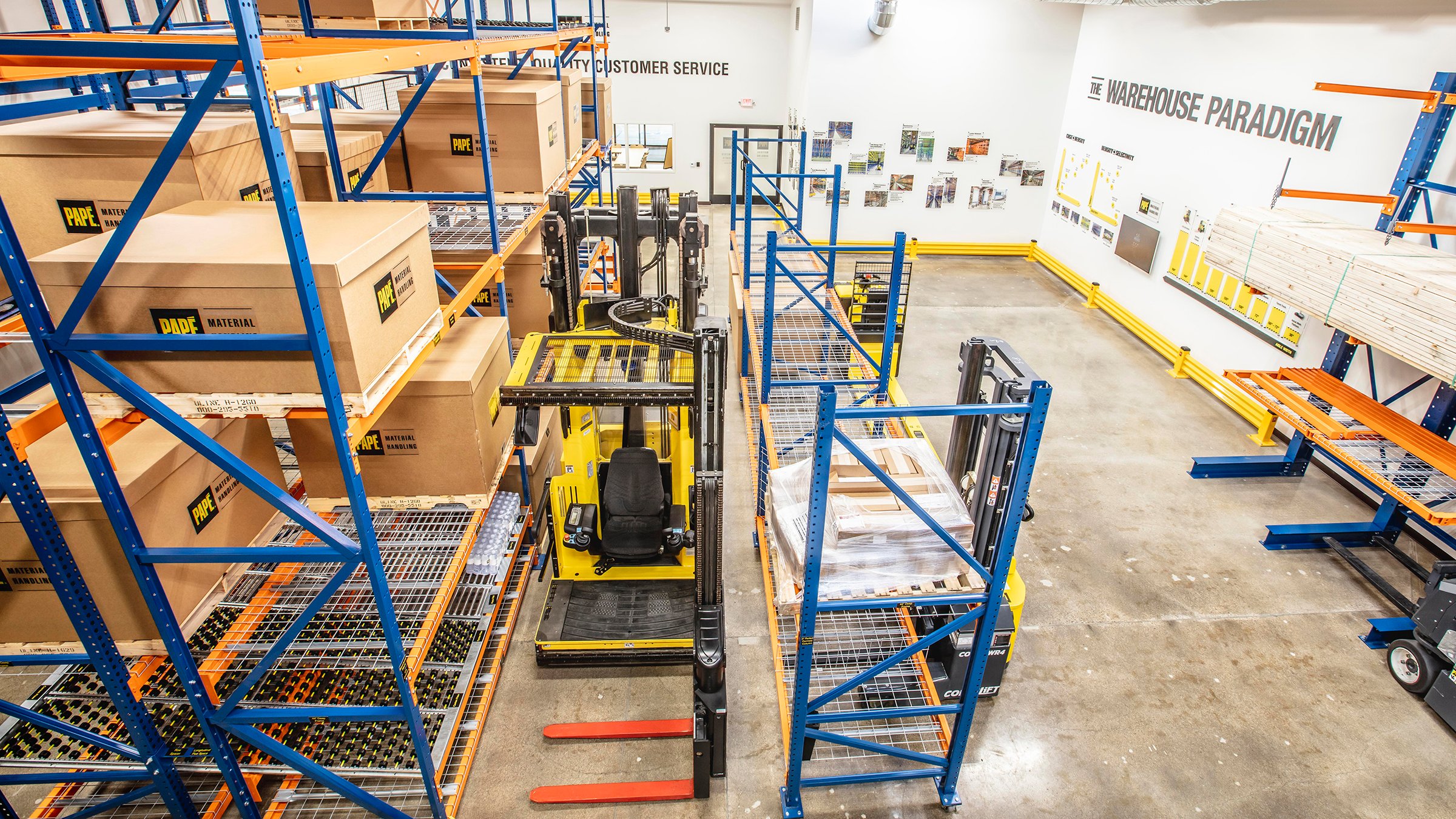Shelving, boxes and forklift in Pape Material Handling Facility